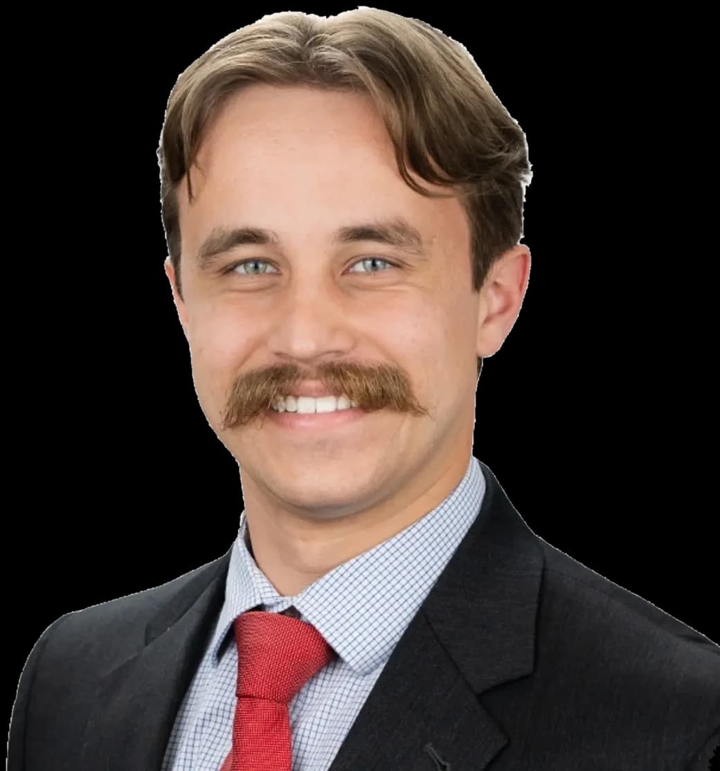 James Latta: portrait of the Coat of Arm Wars founder in a suit and tie